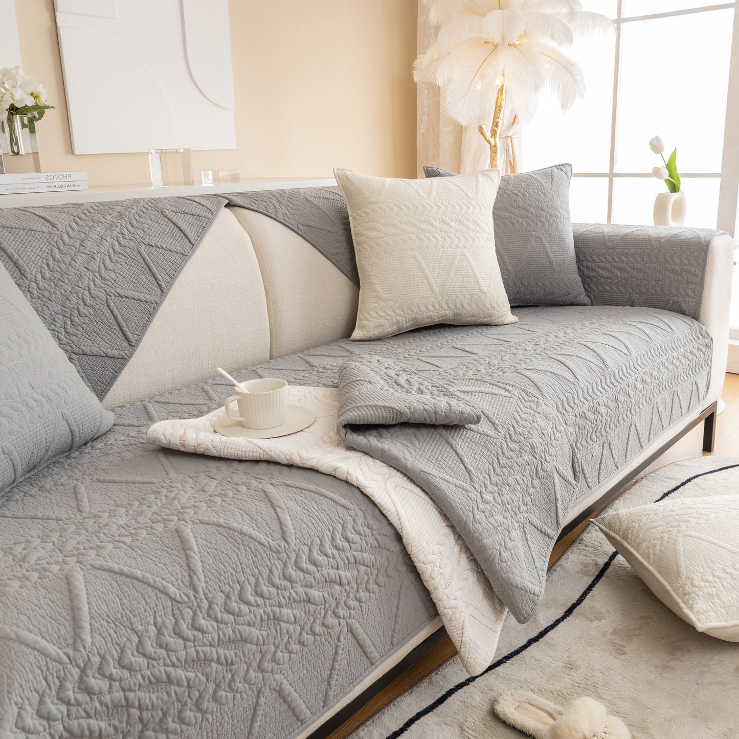 Geometric Textured Cotton Quilted Sofa Cover, Non-Slip Washable Couch Protector on modern living room sofa, adds architectural elegance.