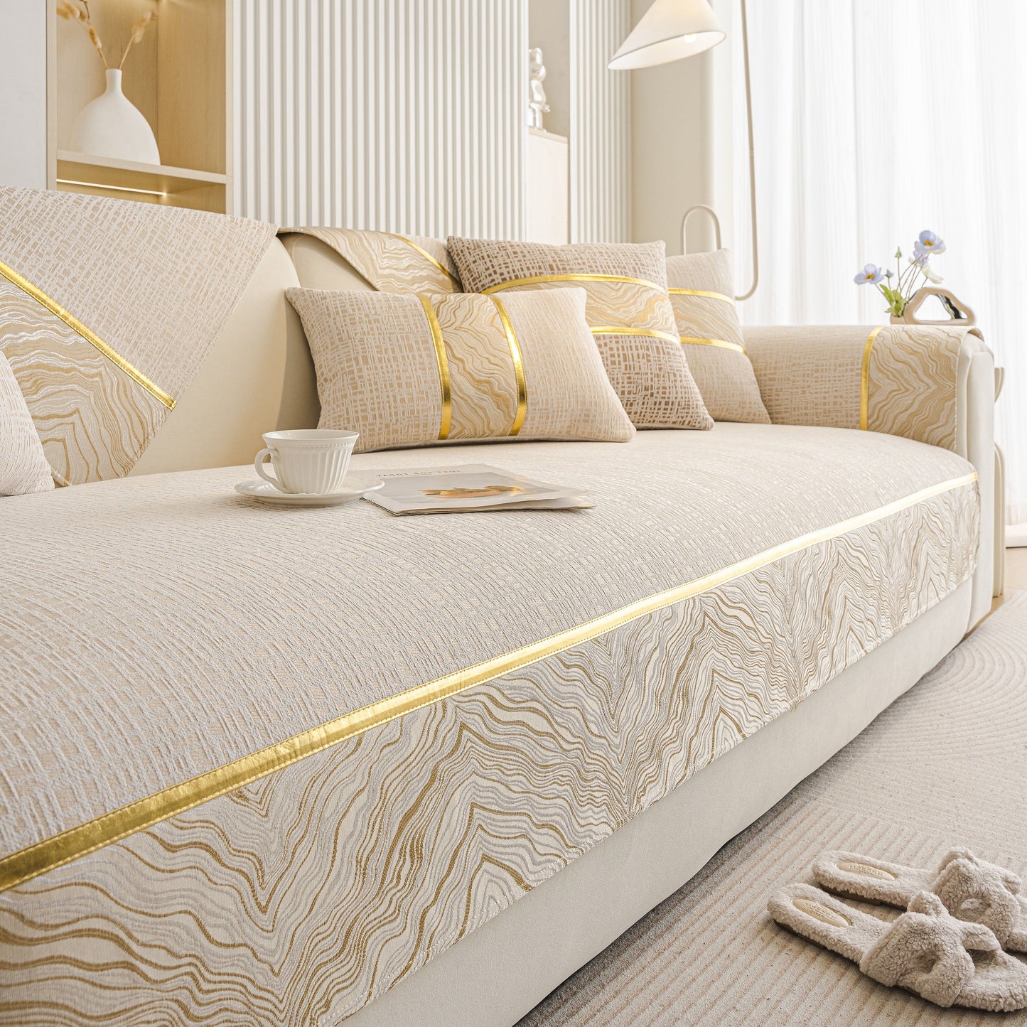 Modern Non-Slip Couch Slipcover, Soft, Durable & Washable Furniture Protector with gold marble-style trim in a living room setting.