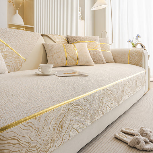 Modern Non-Slip Couch Slipcover, Soft, Durable & Washable Furniture Protector with gold marble-style trim in a living room setting.