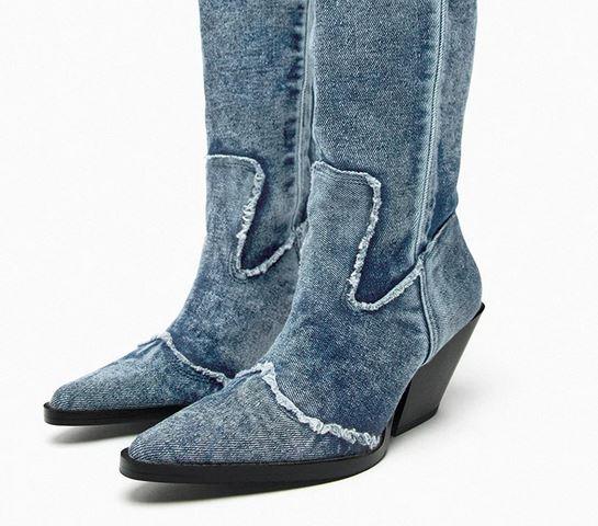 Handcrafted Distressed Denim Knee-High Boots with distressed denim cloth and high heels showcasing cowgirl style.