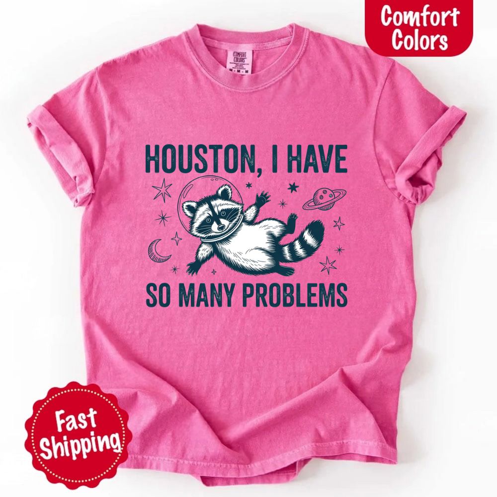Houston I Have So Many Problems Raccoon Comfort Colors T-Shirts in pink with raccoon and space theme, fast shipping available.