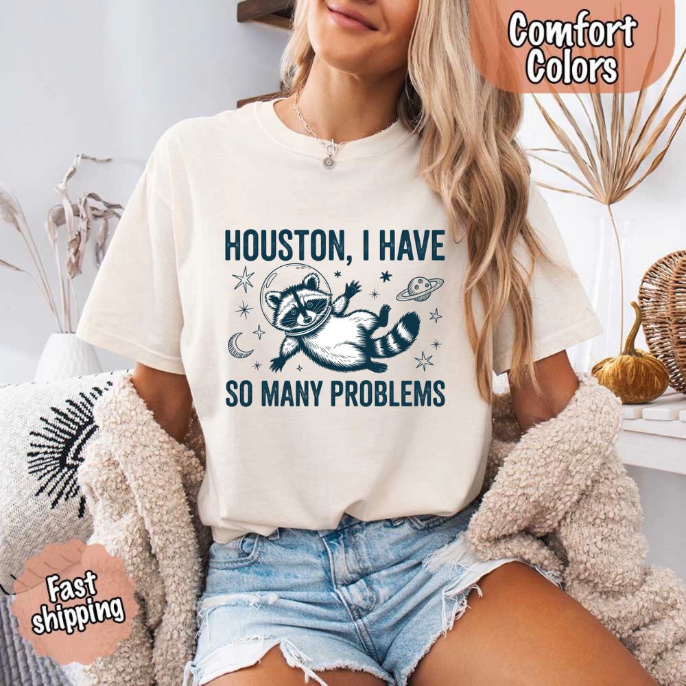 Houston I Have So Many Problems Raccoon Comfort Colors T-Shirt featuring space raccoon design, fast shipping, cozy wear.