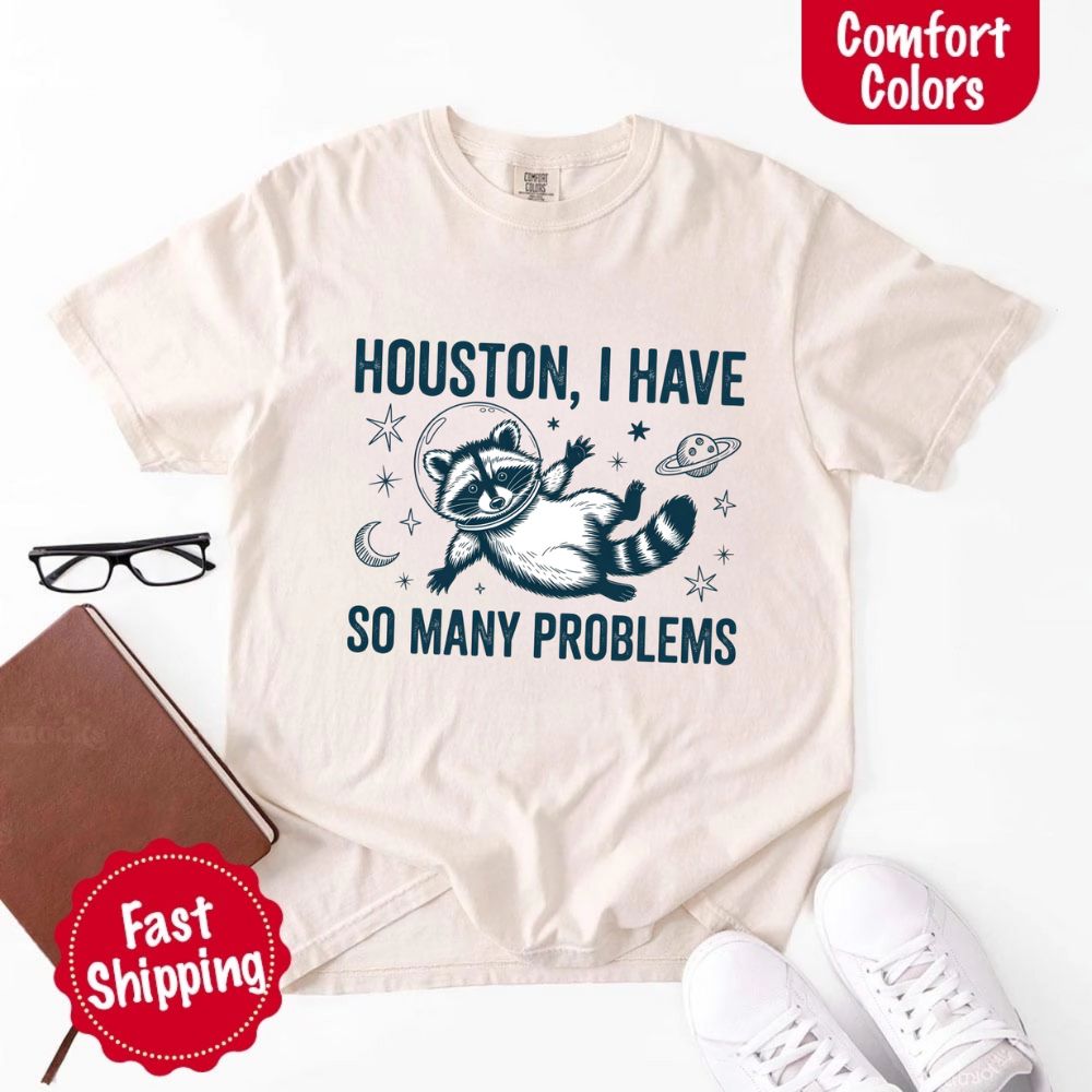 Houston I Have So Many Problems Raccoon Comfort Colors T-Shirts featuring space raccoon design with fast shipping.