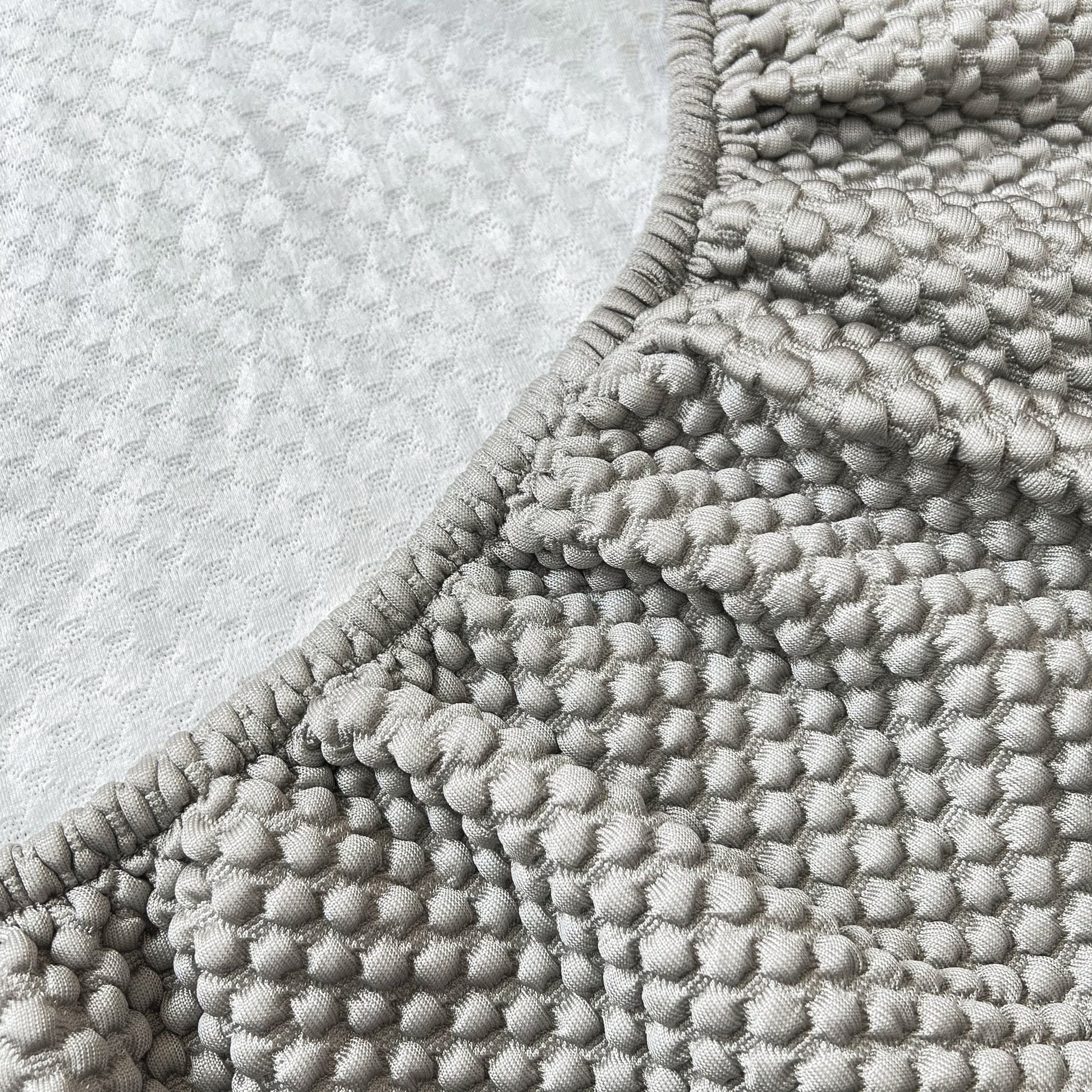 Close-up of Cooling Stretch Sofa Seat Cushion Covers, Slip Covers for Cushions, Universal Couch Cushion Protector texture.