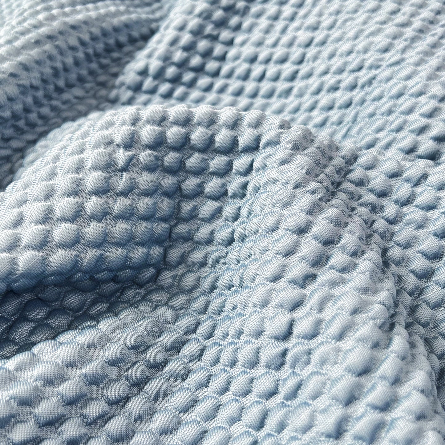 Close-up of textured fabric for Cooling Stretch Sofa Seat Cushion Covers, Slip Covers for Cushions, Universal Couch Cushion Protector.