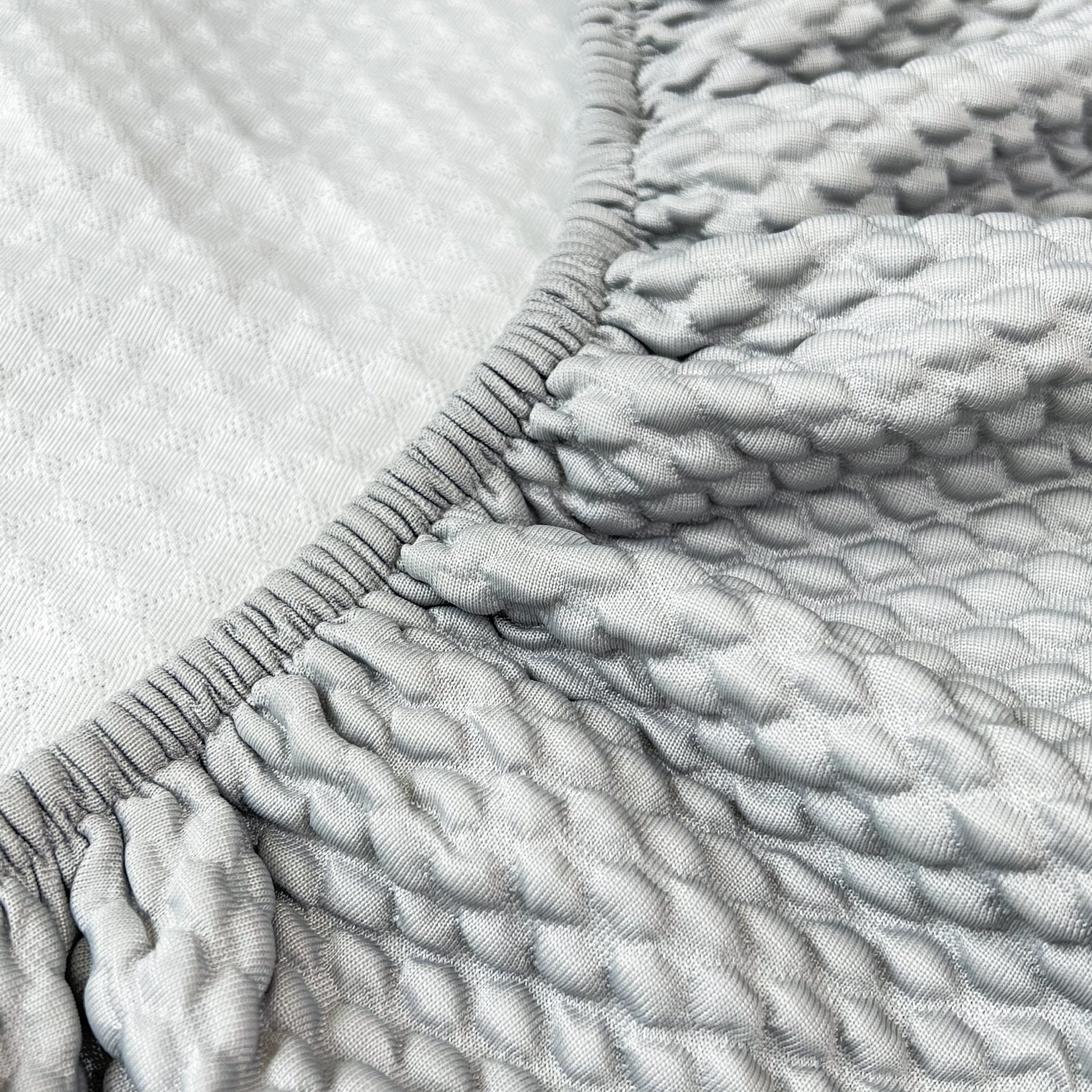 Close-up of Cooling Stretch Sofa Seat Cushion Covers showing textured layers of slip covers for cushions and universal couch cushion protector.