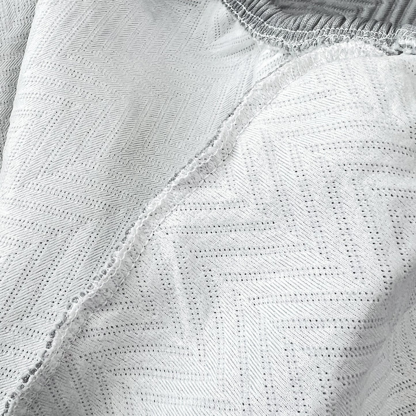 Close-up of Cooling Stretchy Replacement Couch Cushion Covers for Sectional, Individual Couch Seat Cushion Covers in ice silk fabric.