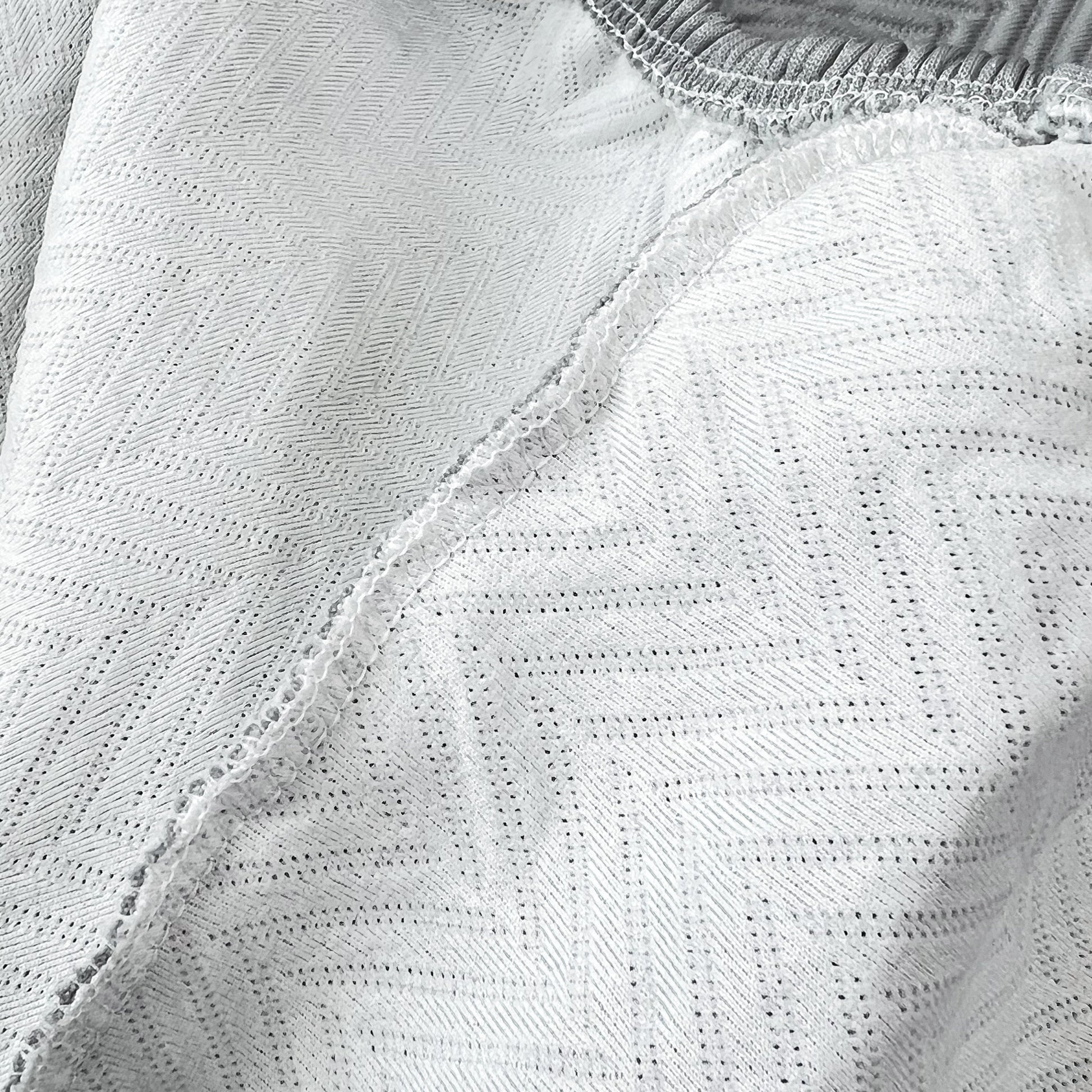 Close-up of Cooling Stretchy Replacement Couch Cushion Covers for Sectional, Individual Couch Seat Cushion Covers in ice silk fabric.