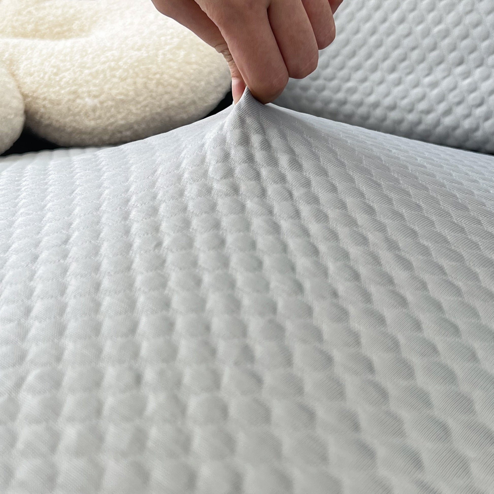 Close-up of Cooling Stretch Sofa Seat Cushion Covers showcasing the texture and snug fit on a couch cushion.