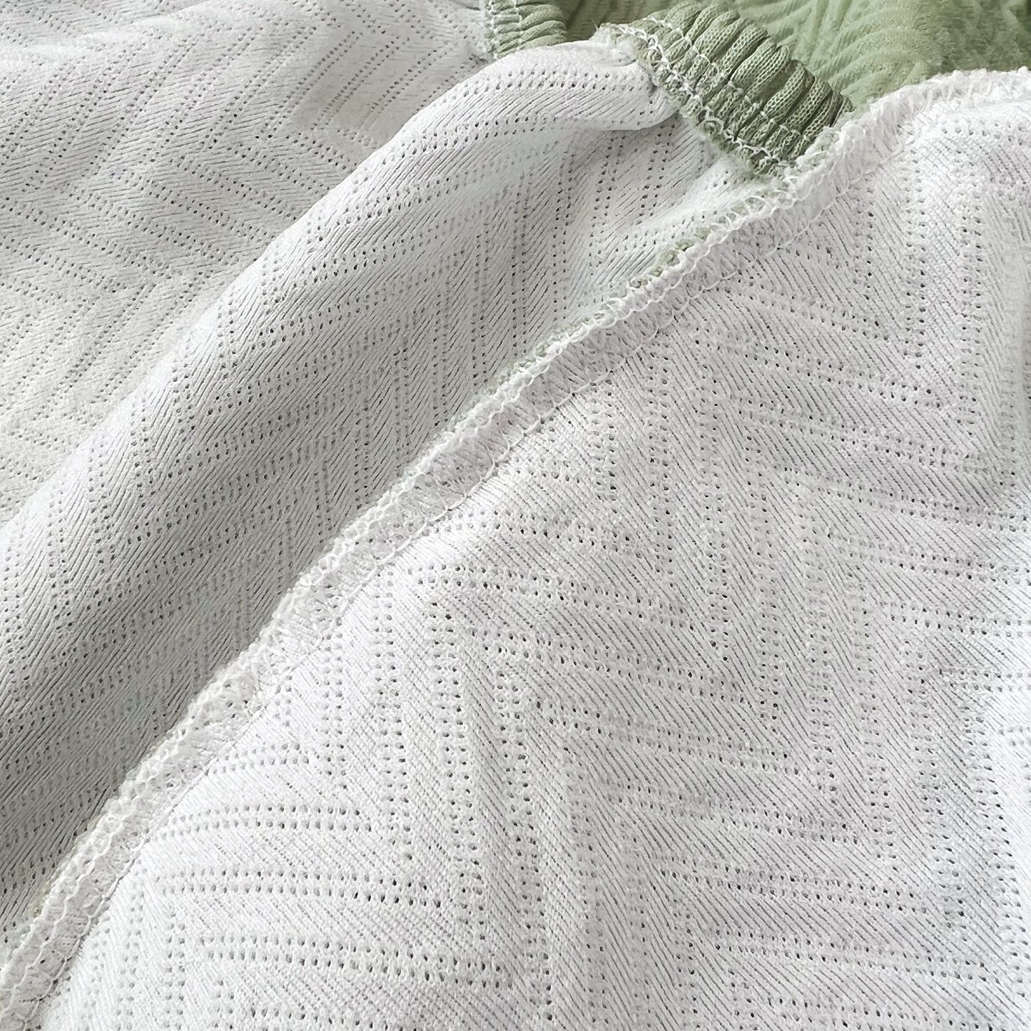Close-up of Cooling Stretchy Replacement Couch Cushion Covers for Sectional, Individual Couch Seat Cushion Covers with ice silk fabric.