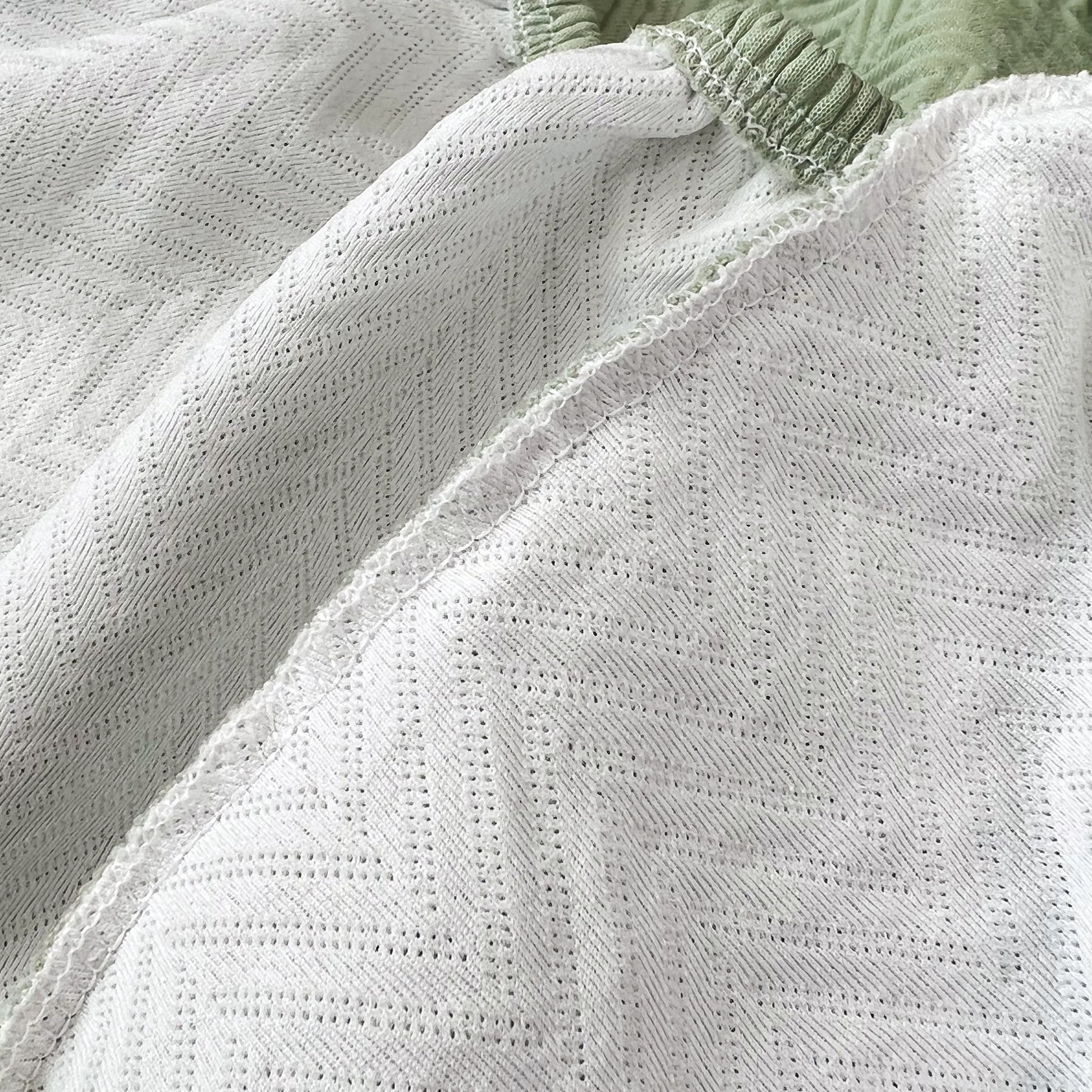 Close-up of Cooling Stretchy Replacement Couch Cushion Covers for Sectional, Individual Couch Seat Cushion Covers with ice silk fabric.