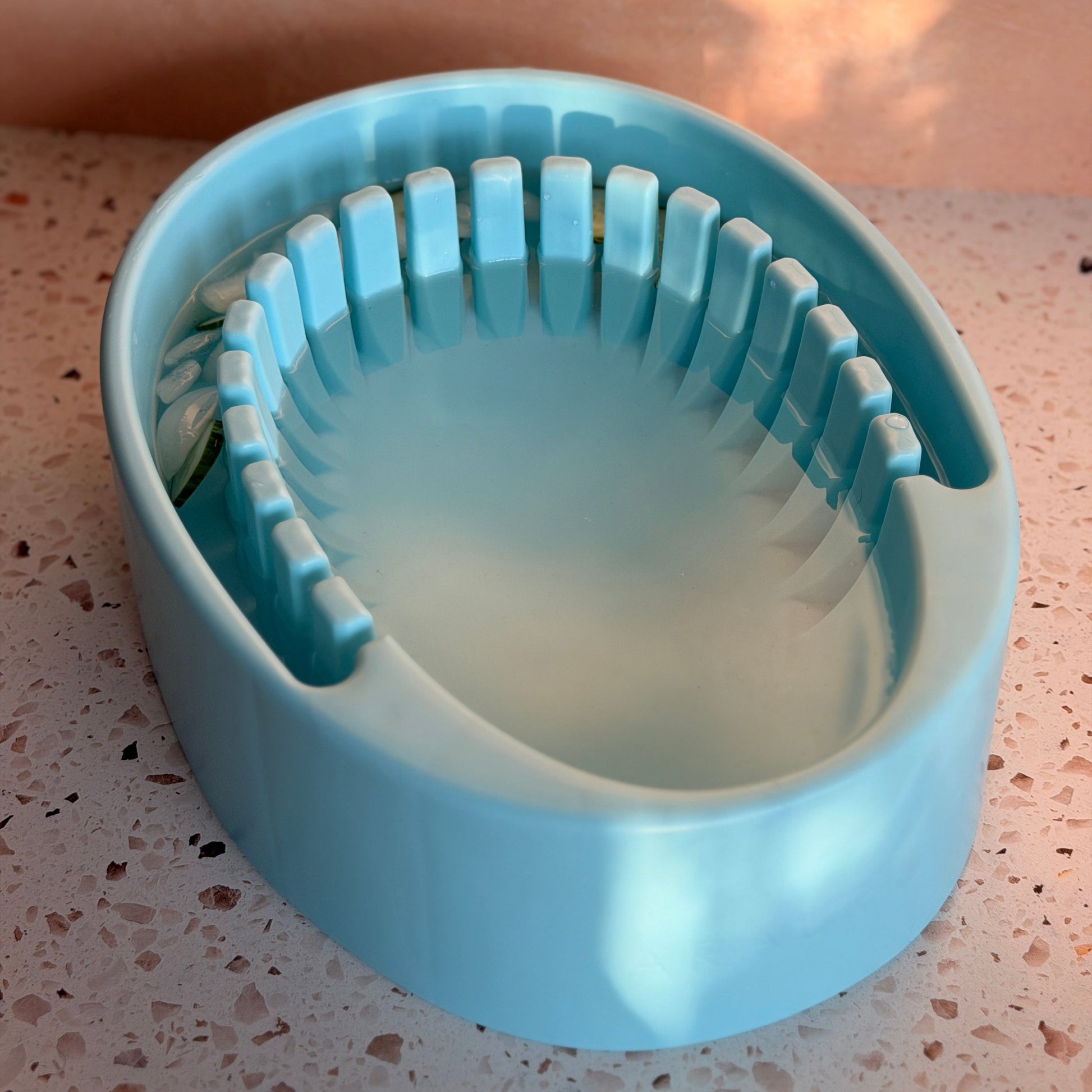 Arauris Pure - Facial Cold Plunge Bowl with Ice Chamber on stone countertop showing inner design