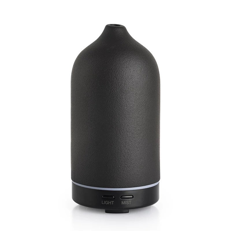 Elegant black ceramic diffuser for aromatherapy with customizable settings and quiet operation.