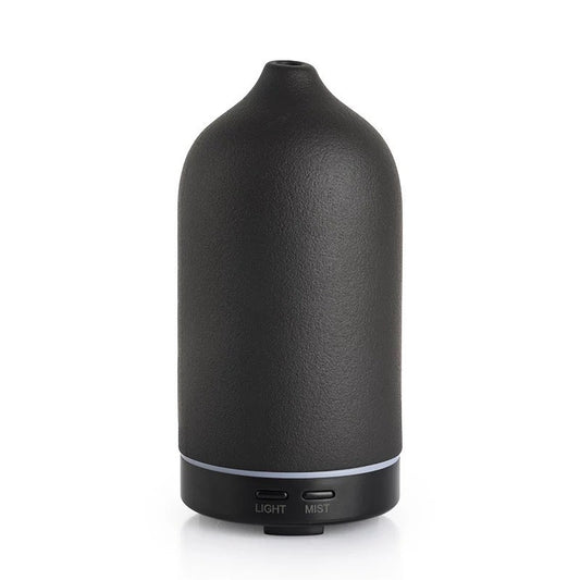 Elegant black ceramic diffuser for aromatherapy with customizable settings and quiet operation.