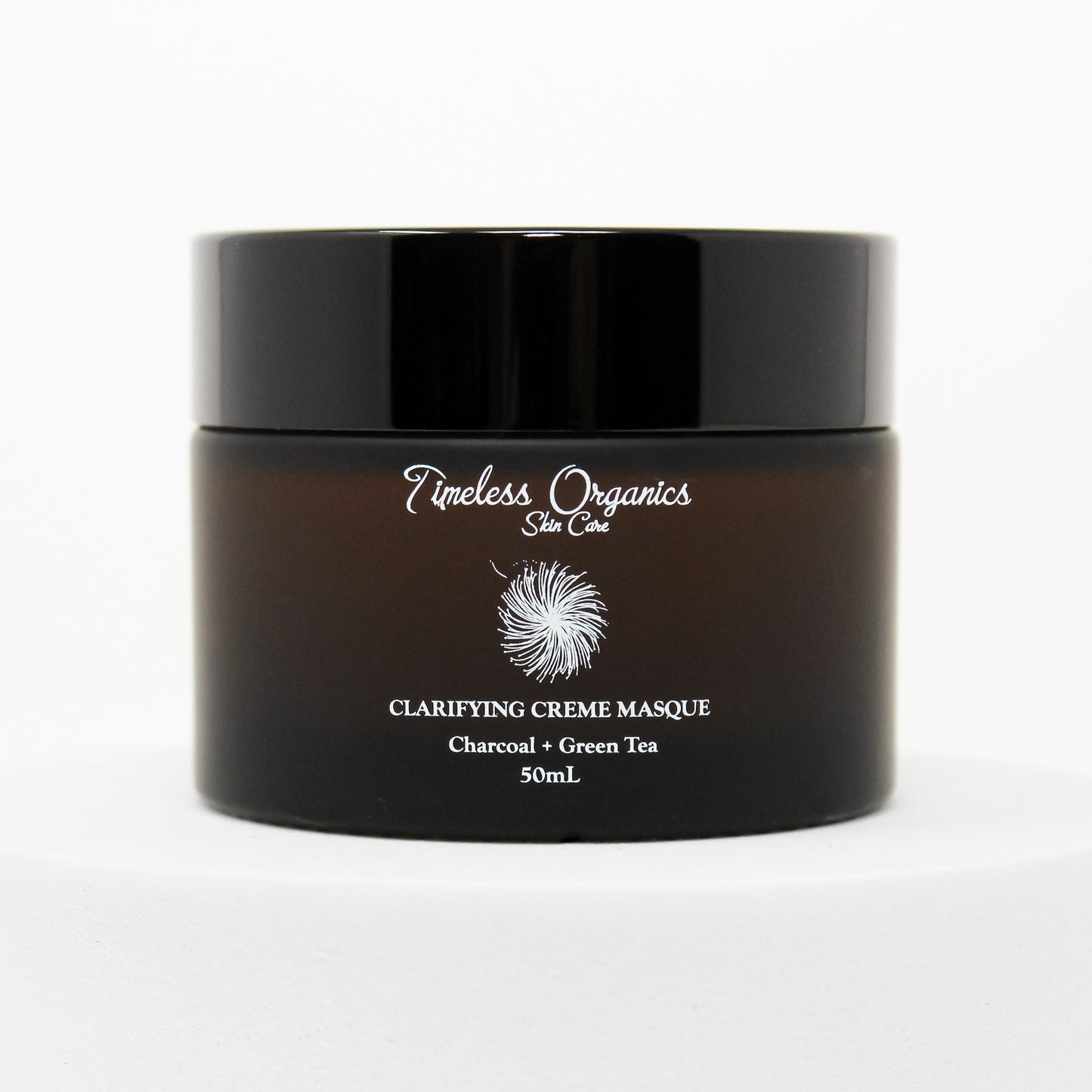 Clarifying Charcoal Creme Masque in 50mL jar for detoxifying and hydrating sensitive skin with vitamins and hyaluronic acid.