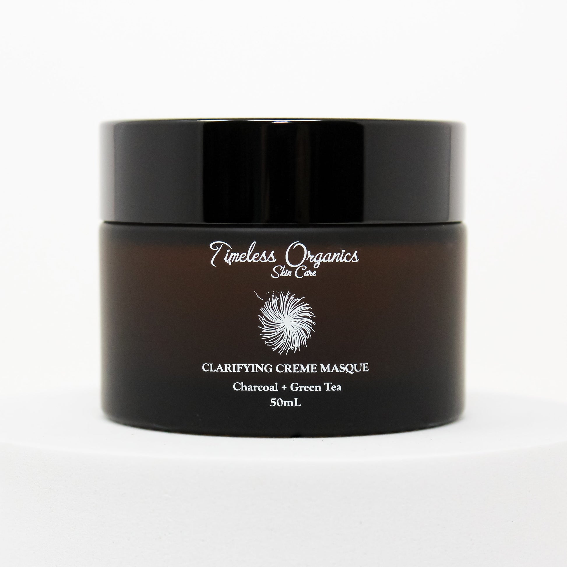 Clarifying Charcoal Creme Masque in 50mL jar for detoxifying and hydrating sensitive skin with vitamins and hyaluronic acid.