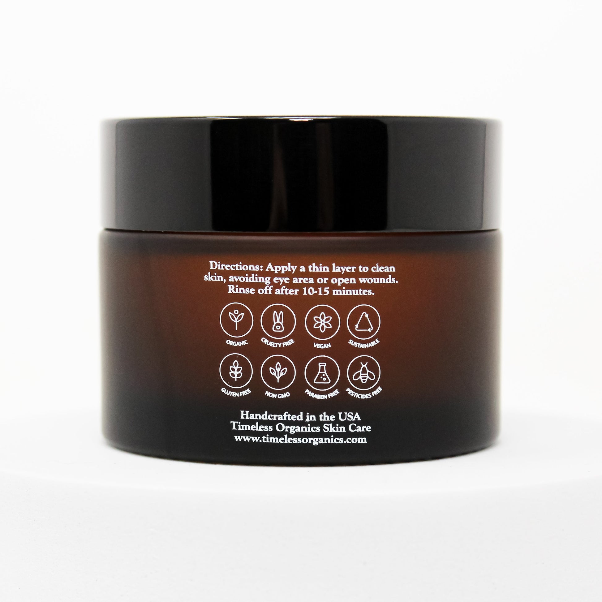 Back view of Timeless Organics Rejuvenating Enzyme Gel Mask jar showing usage instructions and organic symbols.