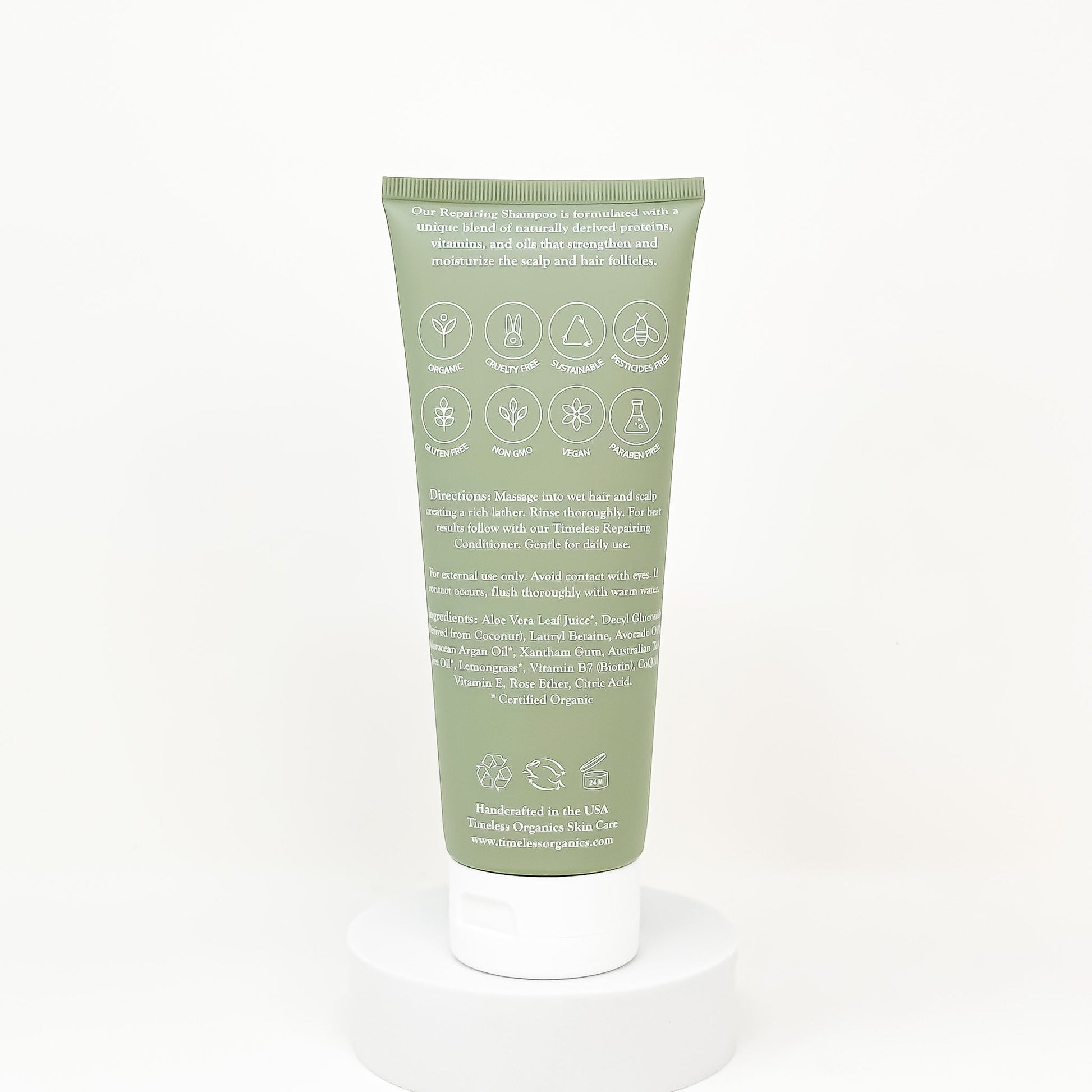 Rear view of Repairing Shampoo bottle with organic ingredients and instructions, 236mL size, eco-friendly packaging.