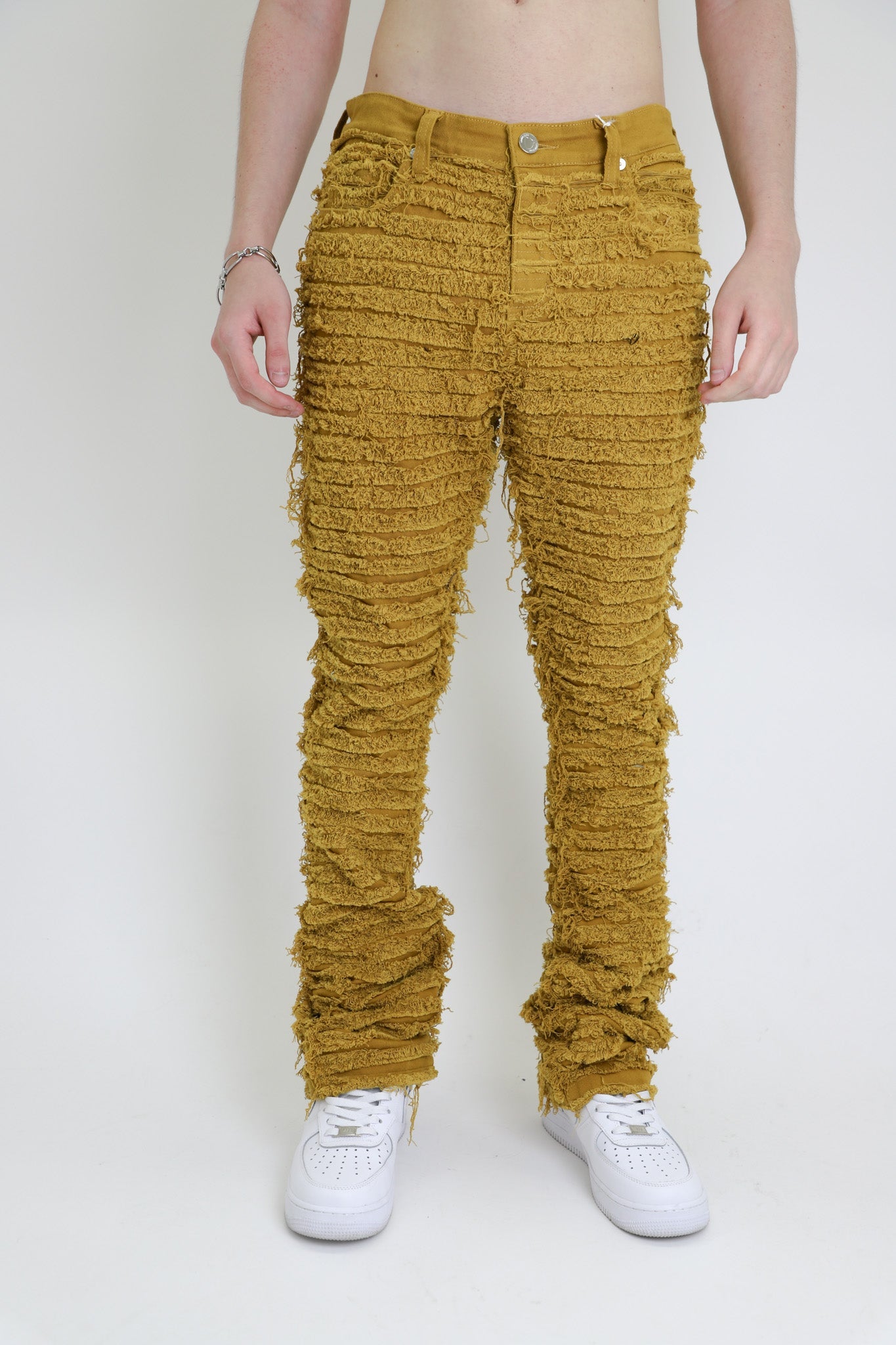AJS693 EXTREME FRAYED STACKED JEANS with mid rise, five-pocket design, and stretchy cotton fabric, showcasing trendy frayed inseam detail.