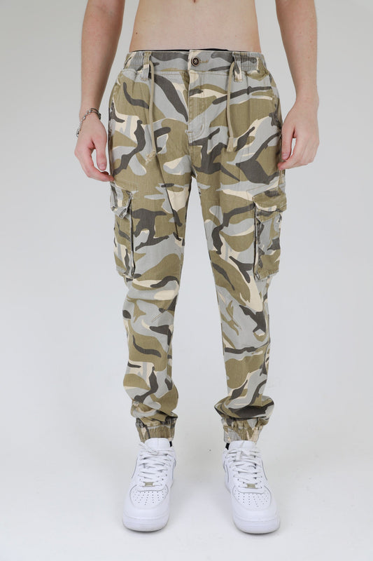 Model wearing AR1001 LIGHT CAMO CARGO JOGGERS with elastic leg openings and side seam cargo pockets.