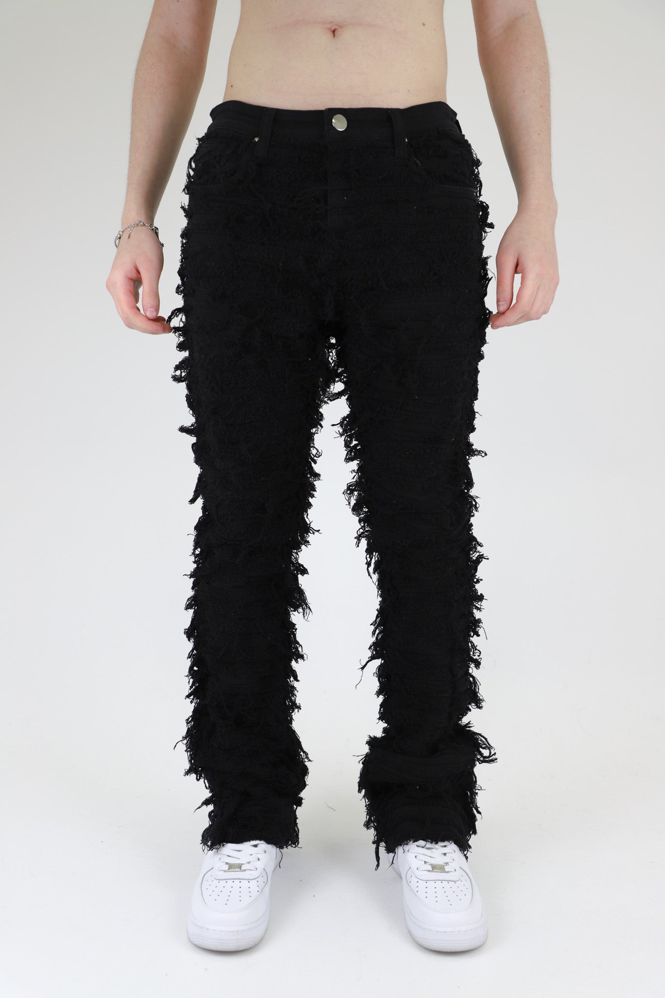 AJS693 EXTREME FRAYED STACKED JEANS with mid-rise waist, stretchy cotton fabric, and five-pocket design
