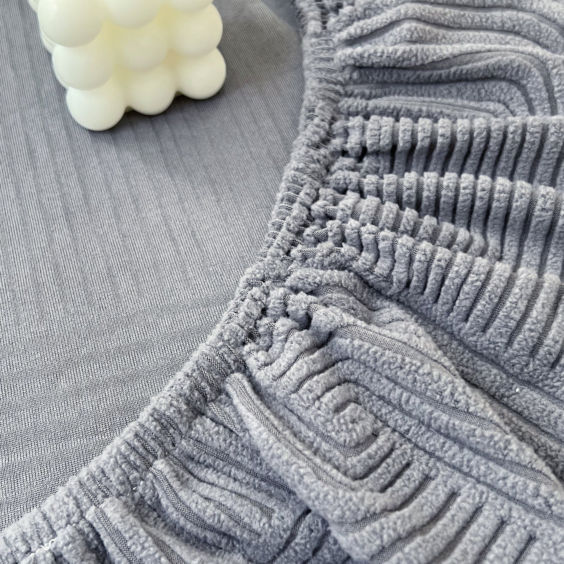 Close-up of Stretch Couch Cushion Covers, Washable Chaise Lounge Sofa Slipcover, Elastic Furniture Protector for Pets, Kid in grey fabric