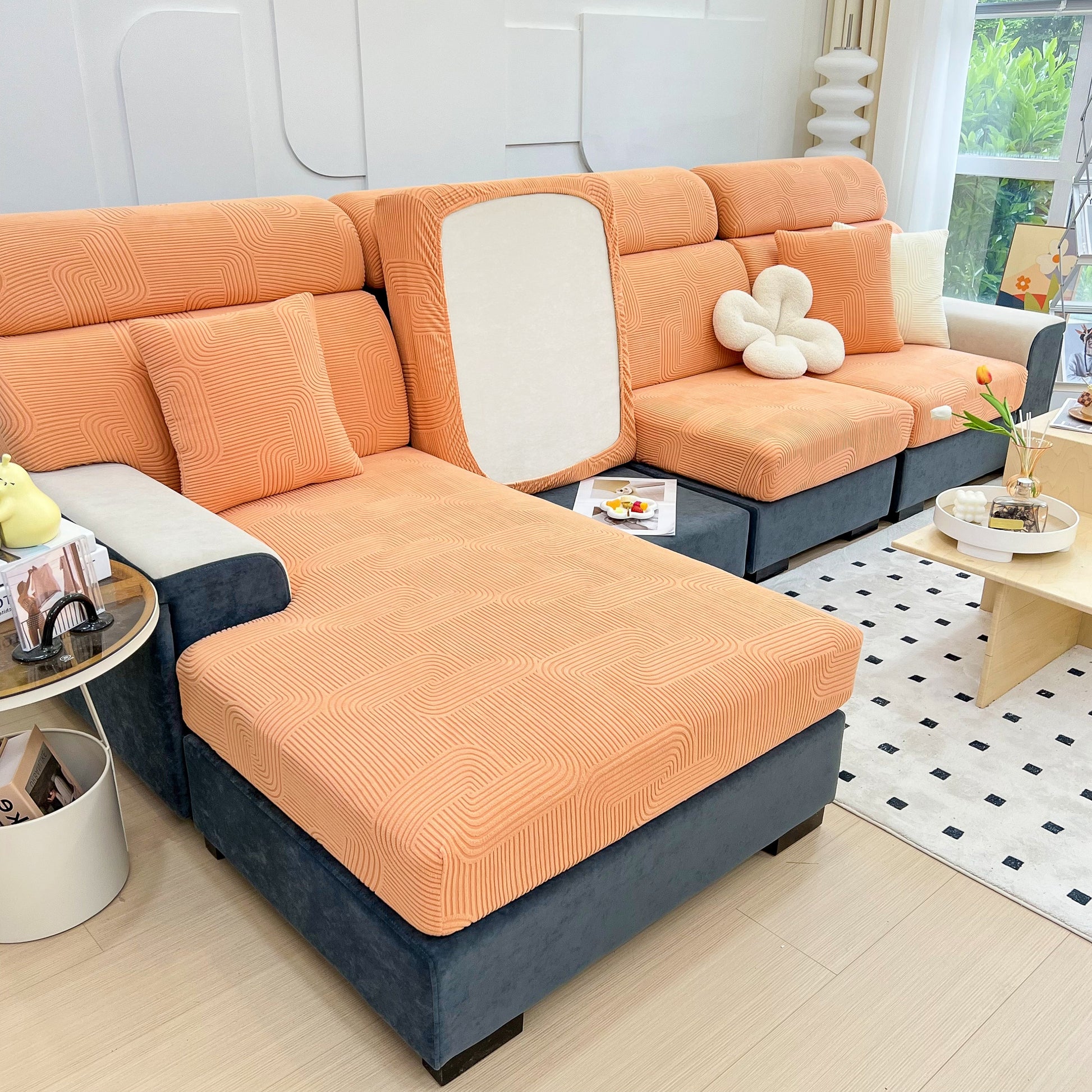 Stretch Couch Cushion Covers, Washable Chaise Lounge Sofa Slipcover, Elastic Furniture Protector for Pets, Kid in orange color, on a chaise sofa.