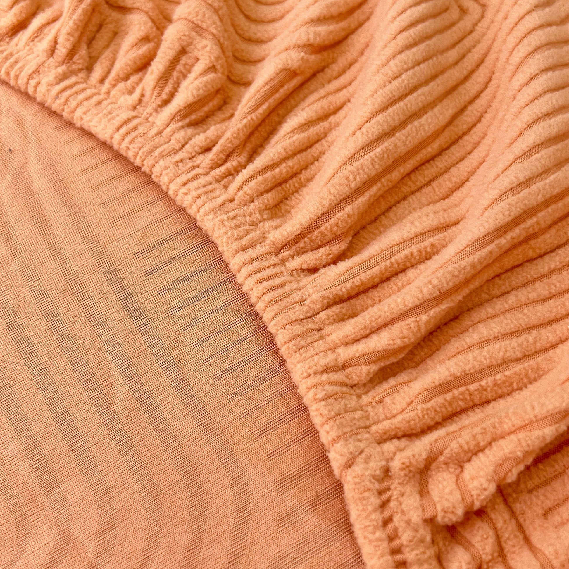 Close-up of Stretch Couch Cushion Covers, Washable Chaise Lounge Sofa Slipcover showing elastic fabric texture for pet and kid protection.