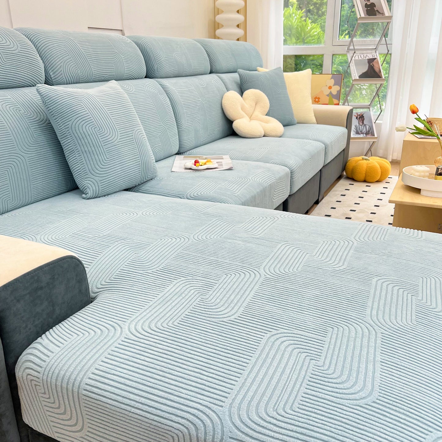 Stretch Couch Cushion Covers, Washable Chaise Lounge Sofa Slipcover, Elastic Furniture Protector for Pets, Kid on a modern sofa.