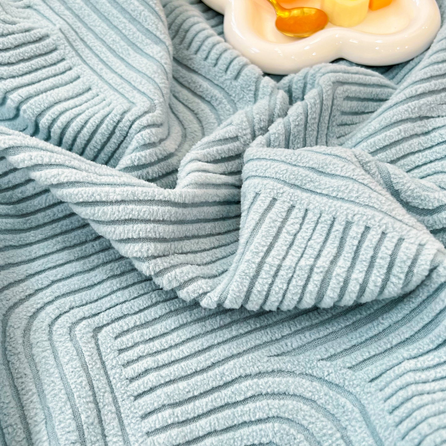 Close-up of a blue Stretch Couch Cushion Covers, Washable Chaise Lounge Sofa Slipcover, Elastic Furniture Protector for Pets, Kid fabric
