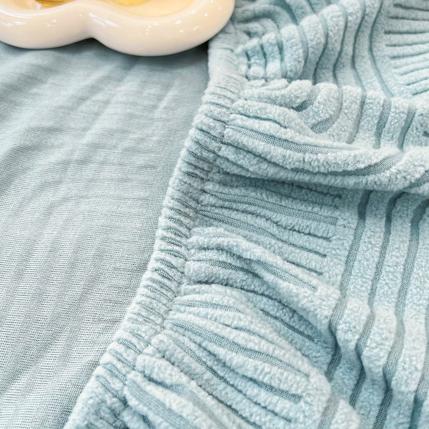 Close-up of washable elastic furniture protector for pets and kids, Stretch Couch Cushion Covers, Chaise Lounge Sofa Slipcover.