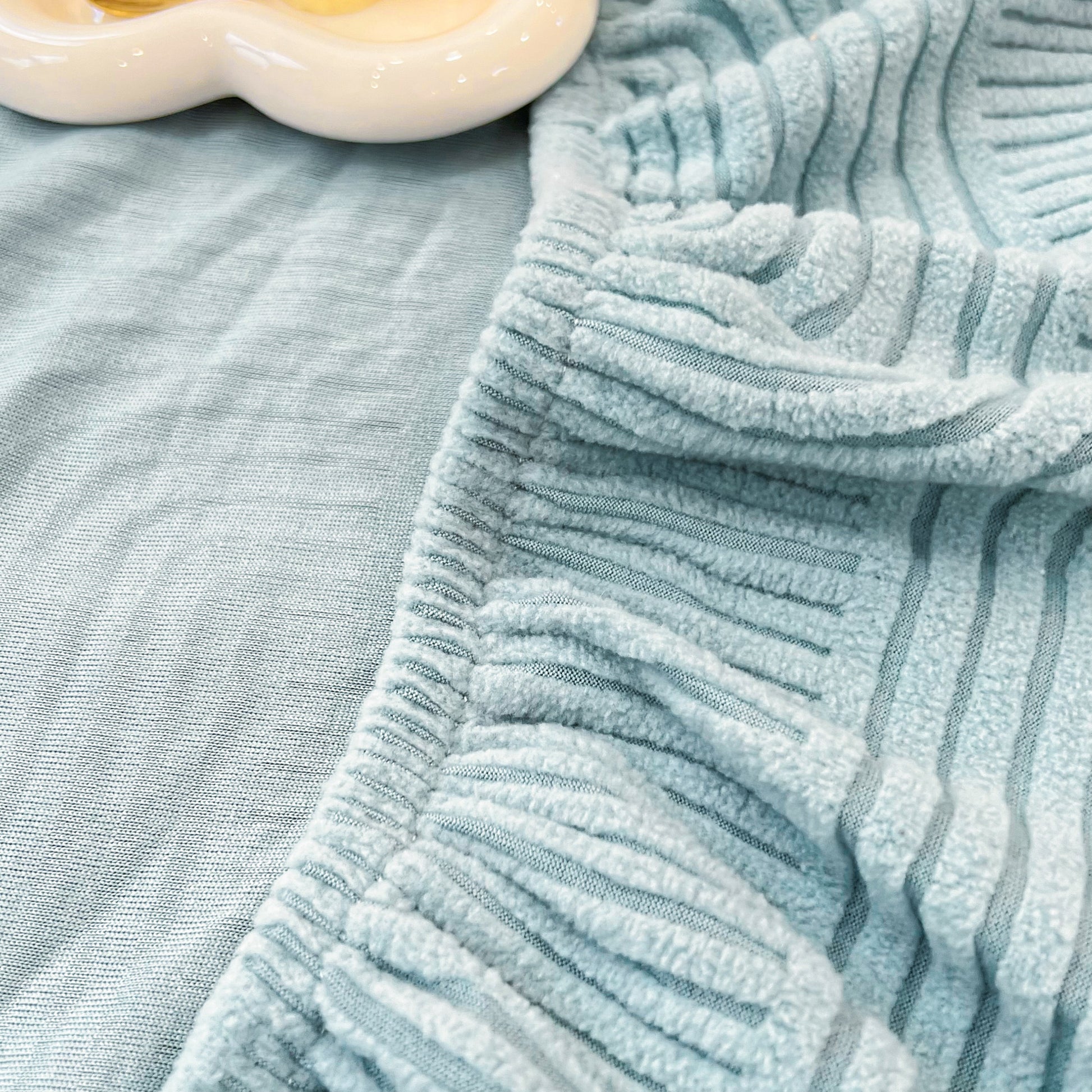 Close-up of washable elastic furniture protector for pets and kids, Stretch Couch Cushion Covers, Chaise Lounge Sofa Slipcover.