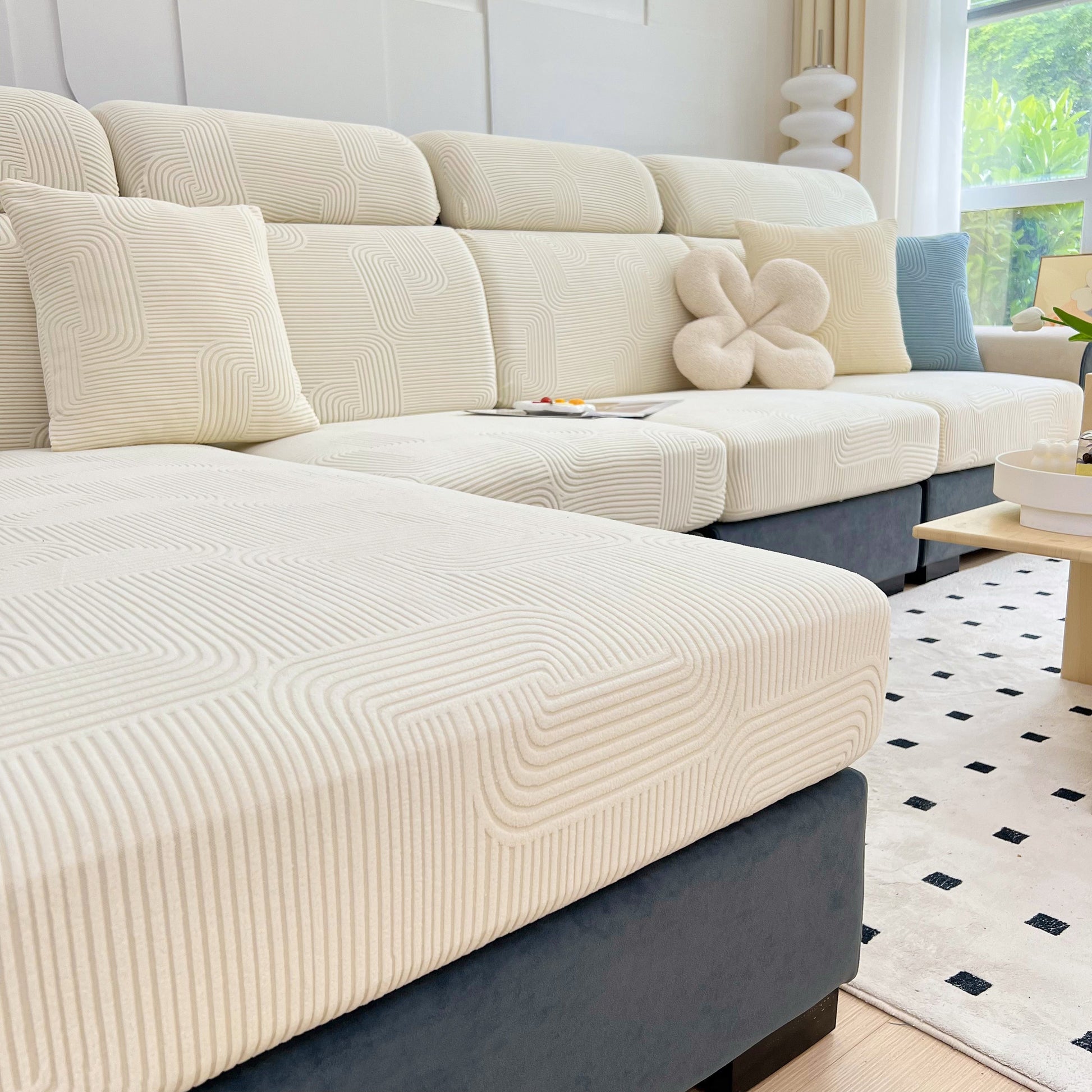 Stretch Couch Cushion Covers, Washable Chaise Lounge Sofa Slipcover, Elastic Furniture Protector for Pets, Kid showcased on a sofa.