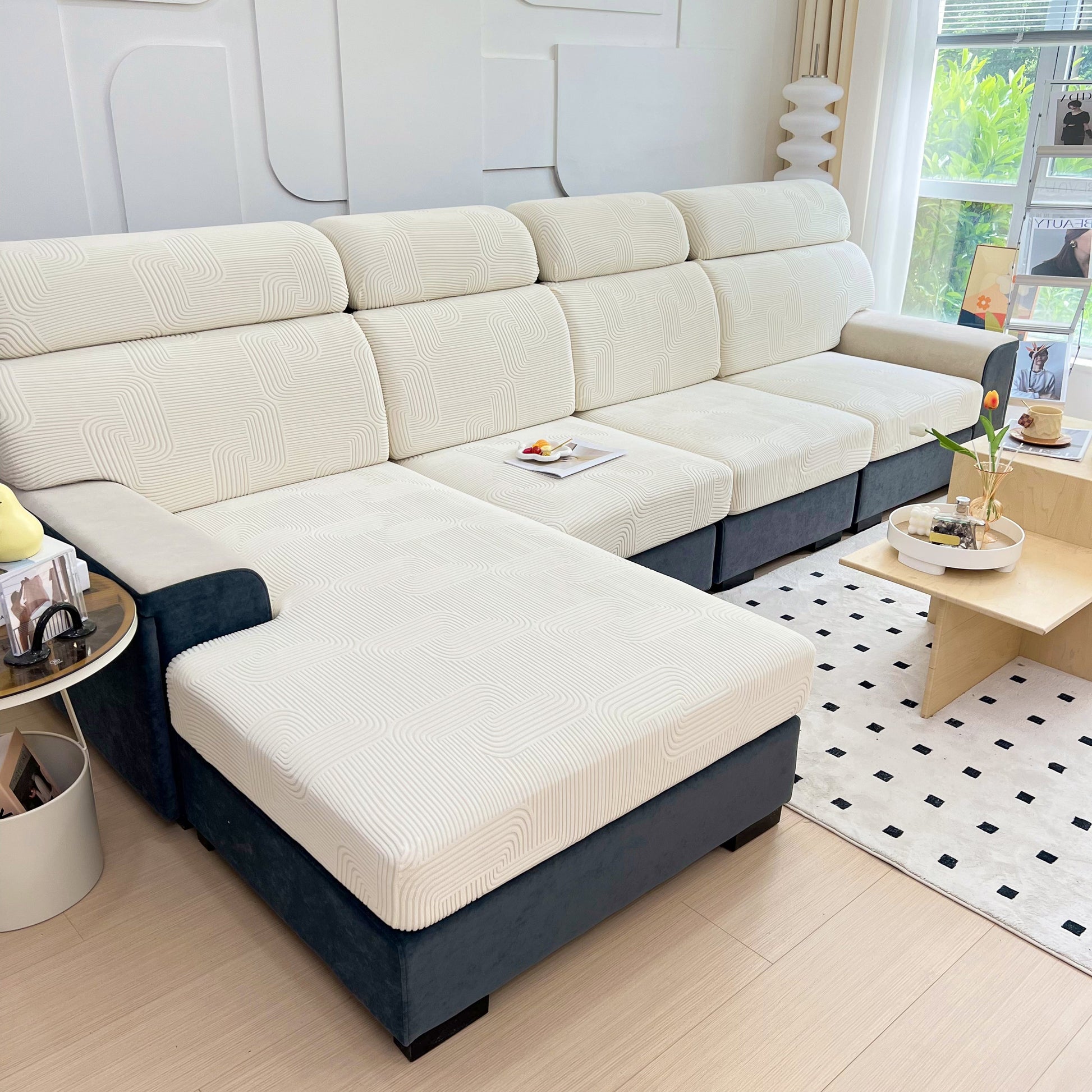 Modern living room with a white and black L-shaped sofa, adorned with Stretch Couch Cushion Covers, Washable Chaise Lounge Sofa Slipcover, Elastic Furniture Protector for Pets, Kid.