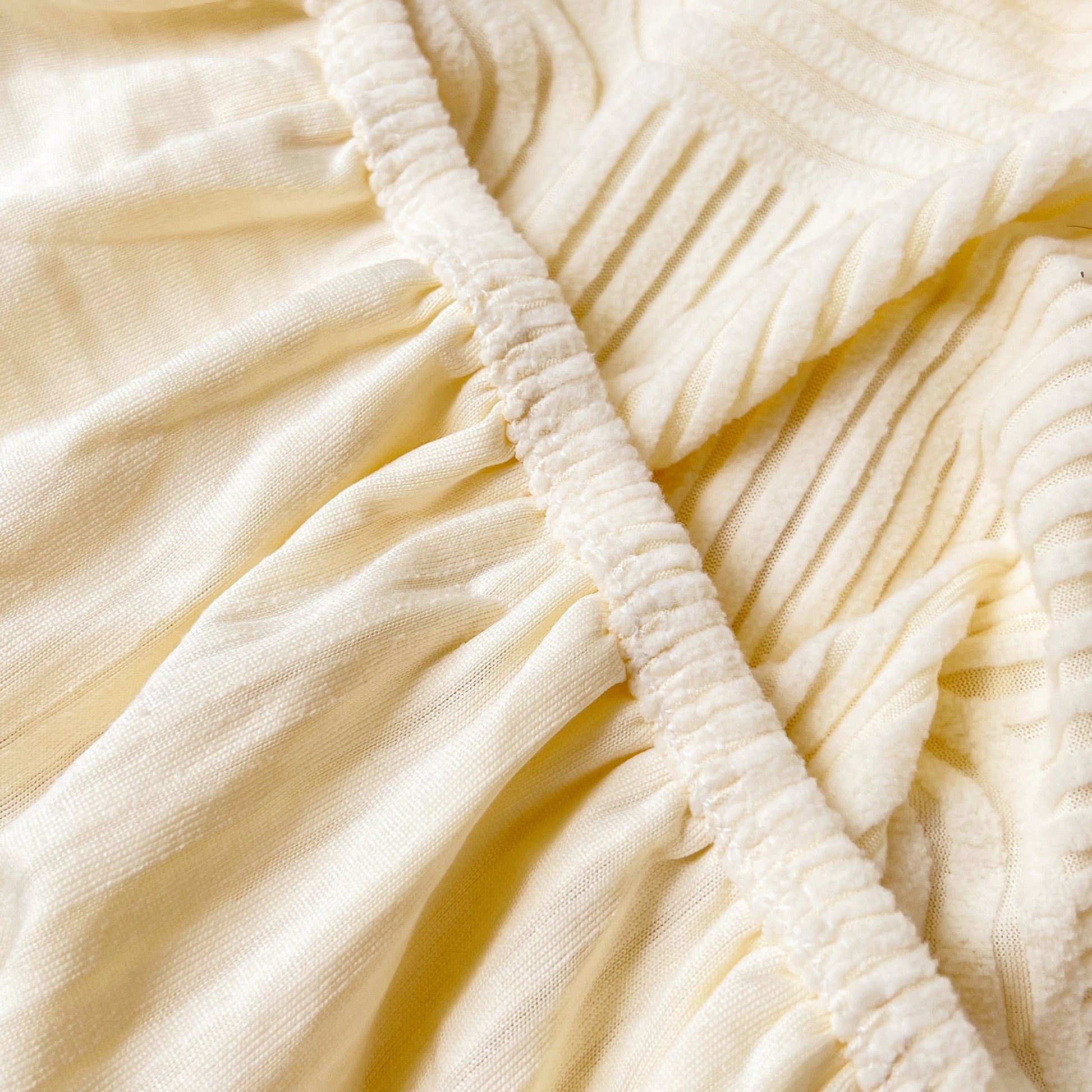 Close-up of elastic fabric detail from Stretch Couch Cushion Covers, Washable Chaise Lounge Sofa Slipcover, Elastic Furniture Protector for Pets, Kid.