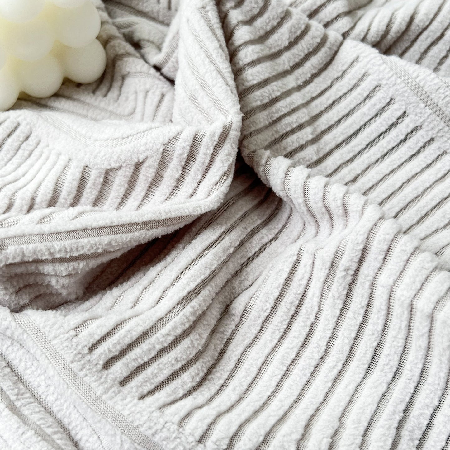 Close-up of Stretch Couch Cushion Covers, Washable Chaise Lounge Sofa Slipcover with textured fabric detail.