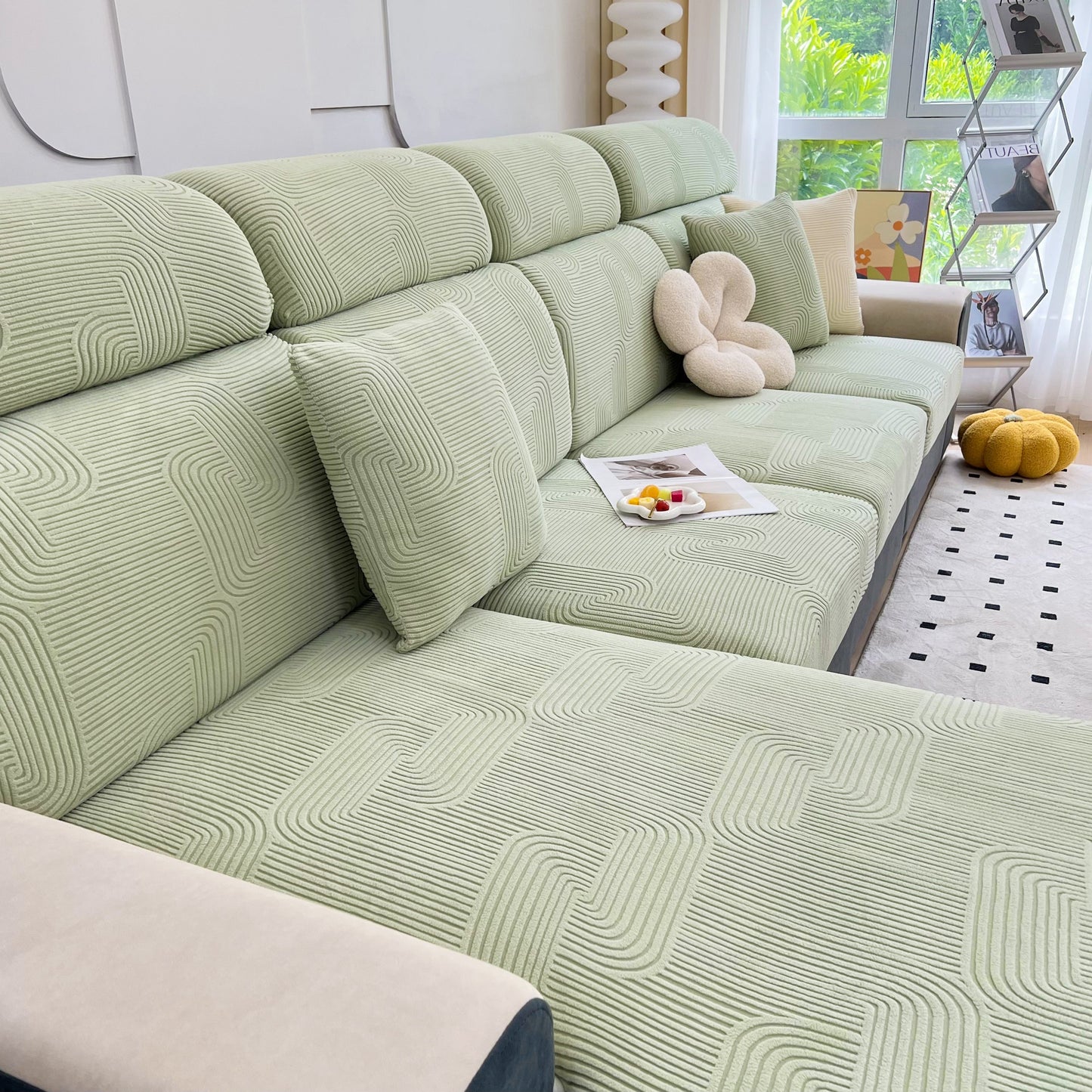 Stretch Couch Cushion Covers on chaise lounge sofa for pet and kid protection, washable elastic slipcover in living room setting.
