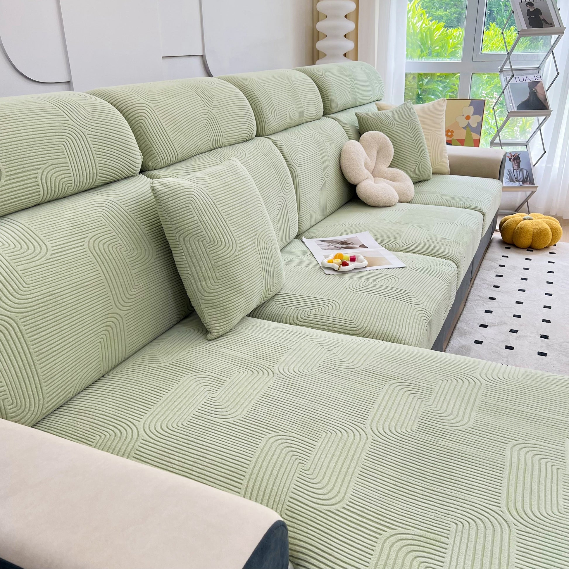 Stretch Couch Cushion Covers on chaise lounge sofa for pet and kid protection, washable elastic slipcover in living room setting.