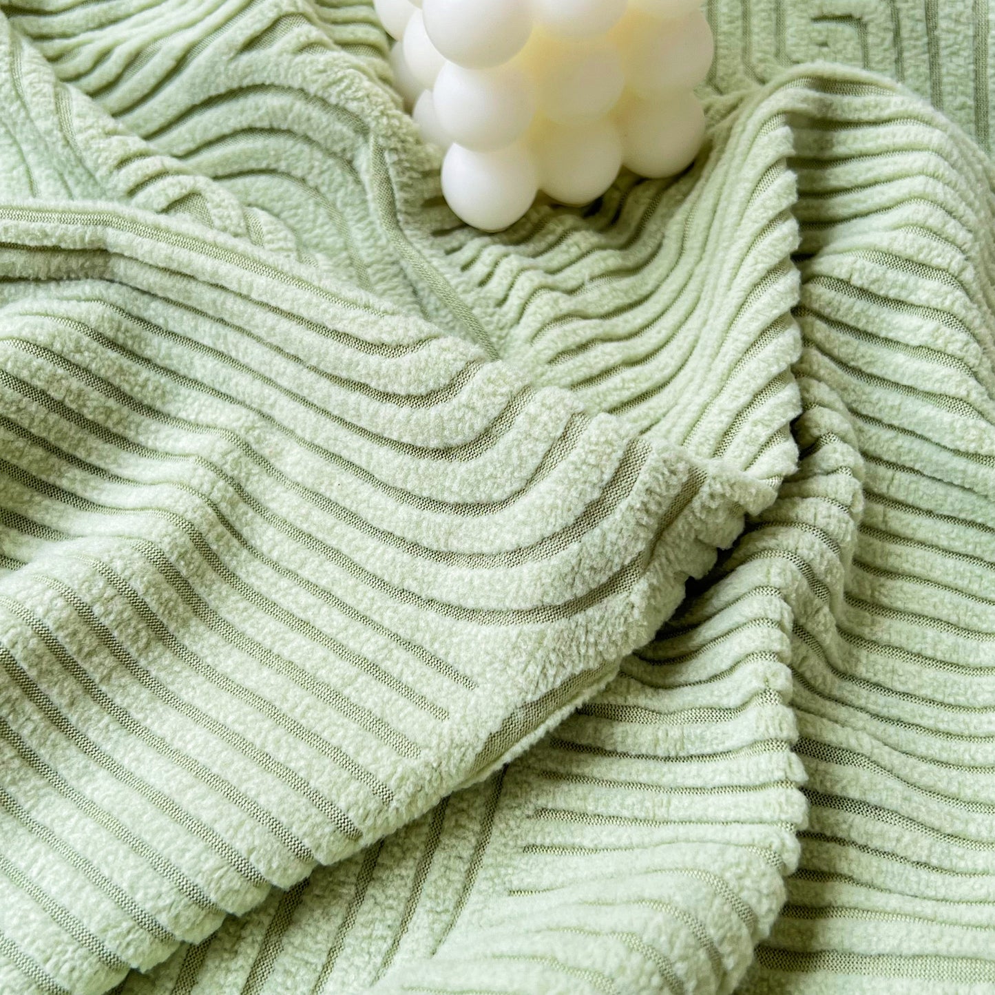 Light green textured fabric of Stretch Couch Cushion Covers, Washable Chaise Lounge Sofa Slipcover, Elastic Furniture Protector for Pets, Kid.