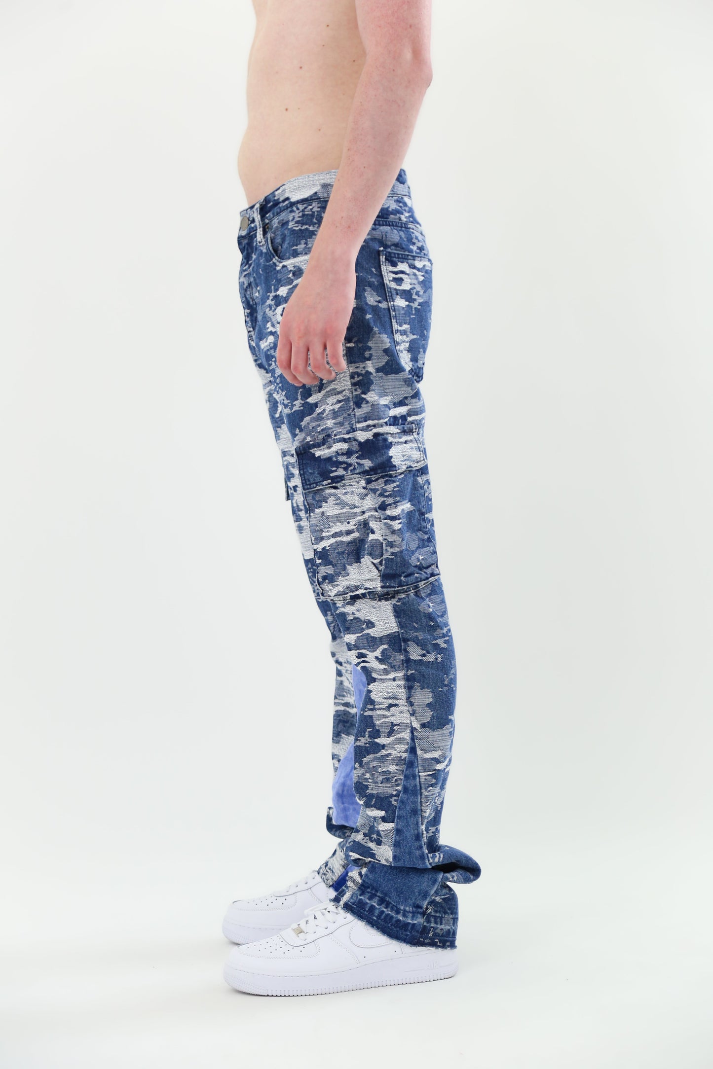 Side view of AJS695 BLUE CARGO JACQUARD STACKED JEANS showcasing mid rise, jacquard pattern, and non-stretch cotton fabric.