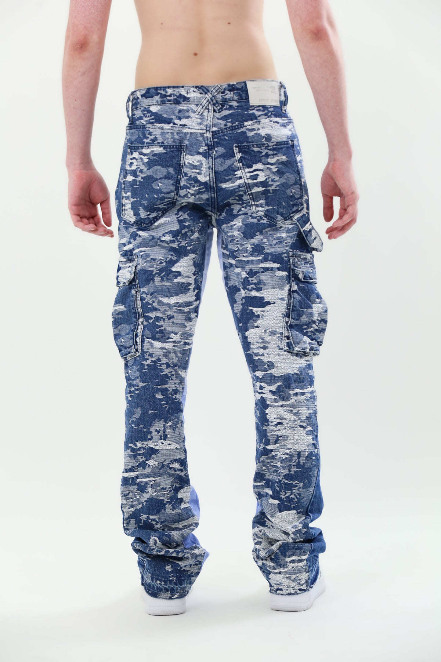 Back view of AJS695 BLUE CARGO JACQUARD STACKED JEANS with mid-rise waist and non-stretchy fabric.