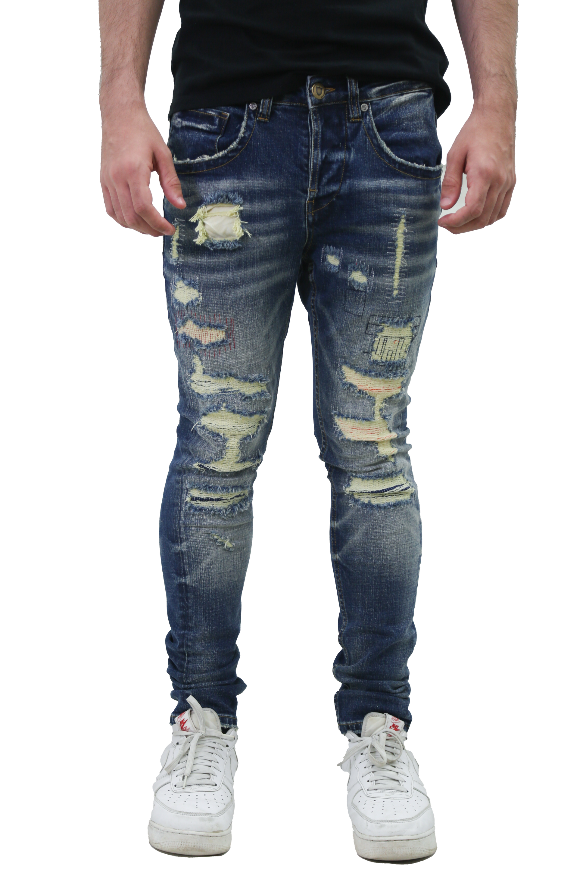 RIPPED MID-RISE SKINNY JEANS with a five-pocket design and stretchy cotton fabric, featuring belt loops, button, and zipper fly.