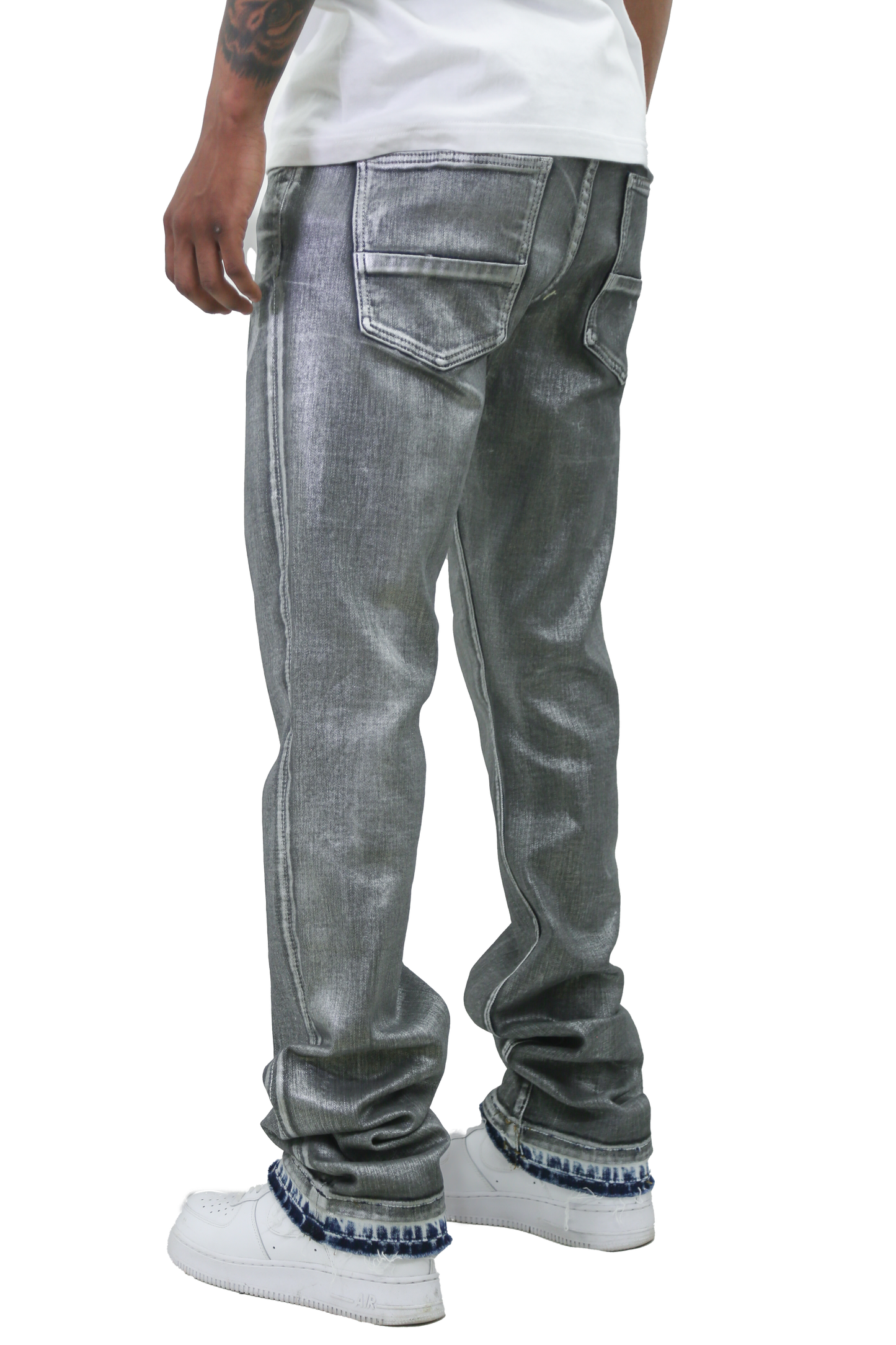 Back view of METALLIC PRINTED STACKED JEANS AJ07C worn by a man, showcasing stylish metallic finish and unique stacking design.