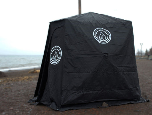 Full Cover for Nova 4 Sauna Tent protecting against rain on a beach