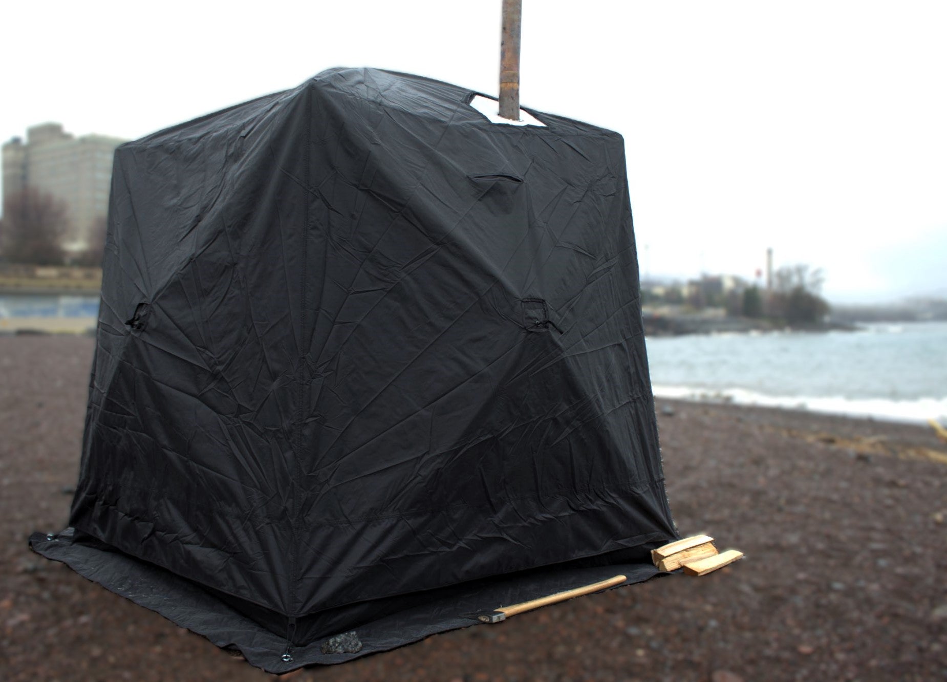 Full Cover for Nova 4 Sauna Tent providing rain protection with window, installed on beach - durable and weather-resistant design