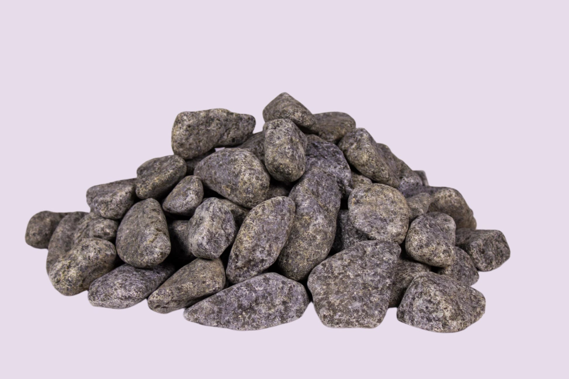 Pile of rounded sauna stones for consistent heating and genuine sauna experience