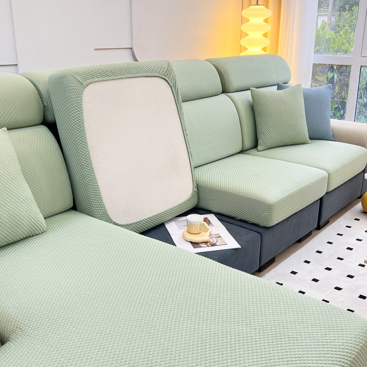 Cooling Stretch Sofa Seat Cushion Covers, Slip Covers for Cushions, Universal Couch Cushion Protector on a green sofa
