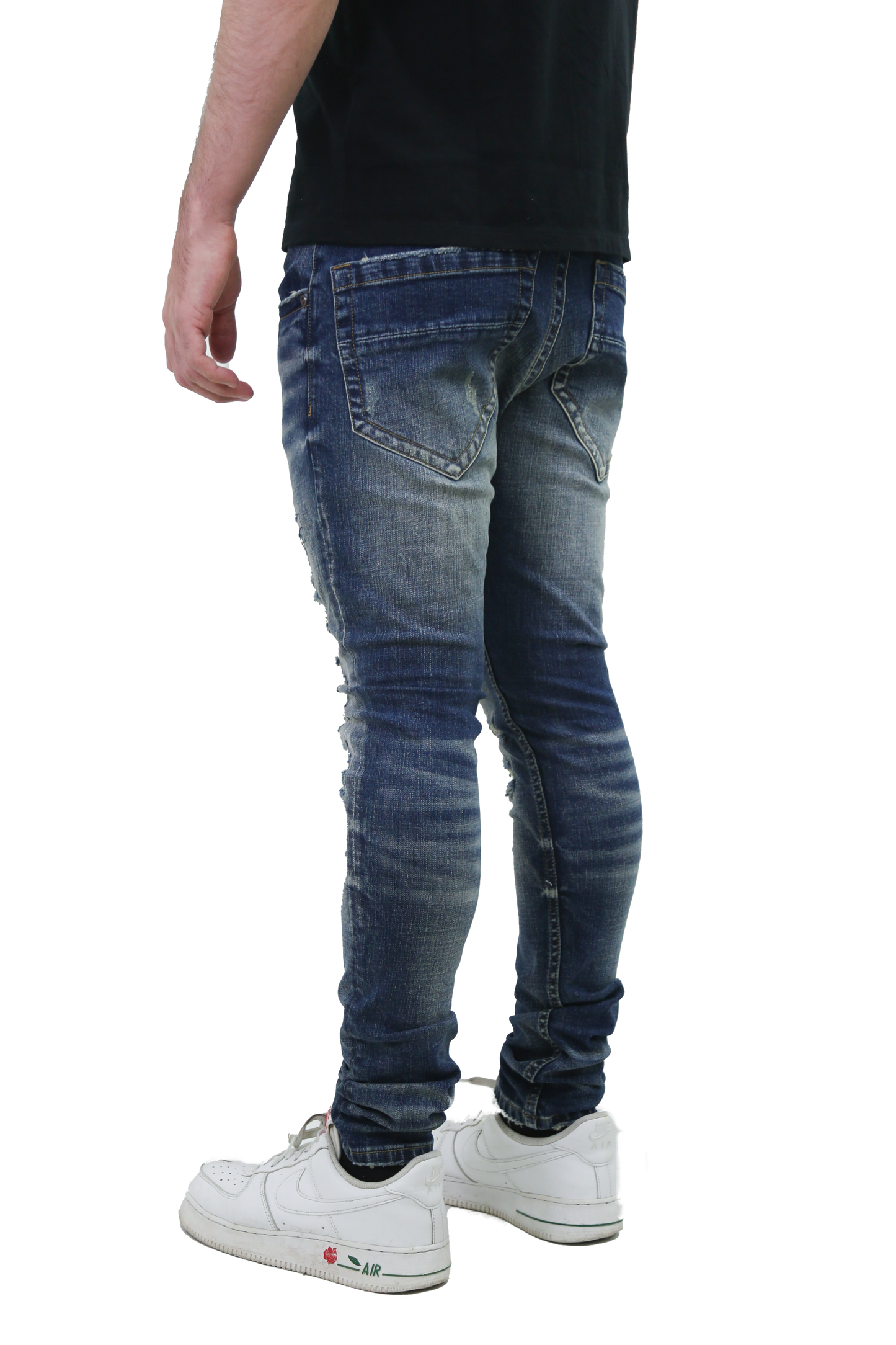 Back view of RIPPED MID-RISE SKINNY JEANS showcasing five-pocket design and mid-rise waist