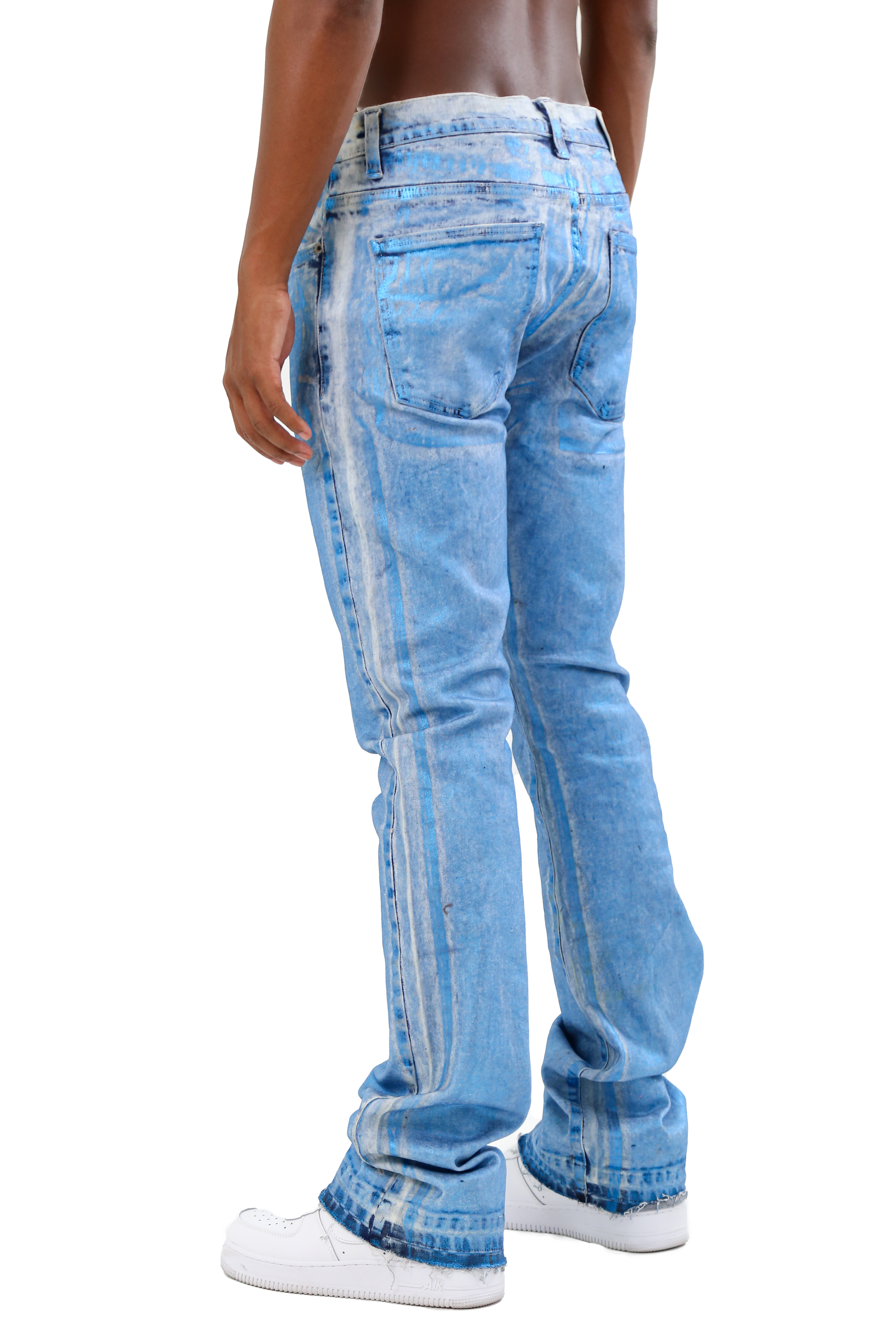 Back view of ASJ08 FOIL WASH STACKED JEANS, mid-rise with a foil wash, showing five-pocket design and stacked legs, worn by a model.