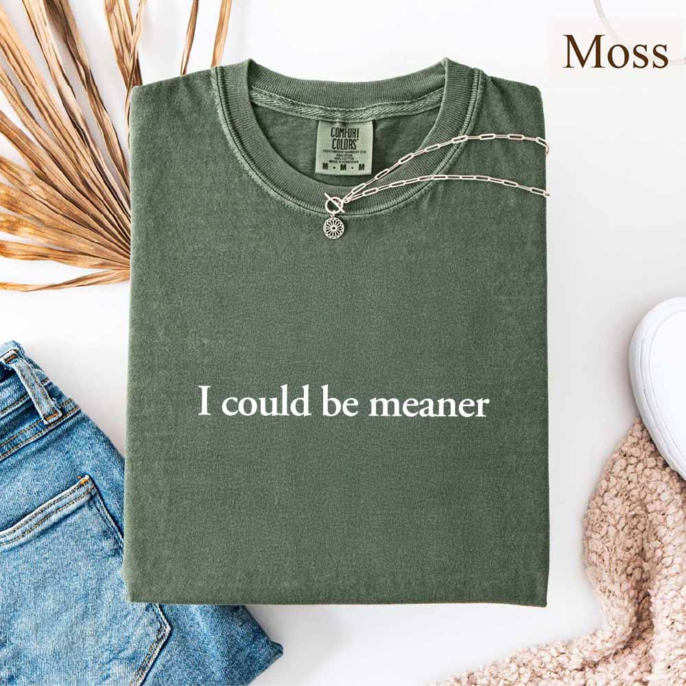 I Could Be Meaner Funny Sarcastic Tee in moss green color with necklace, perfect for trendy streetwear and casual style.